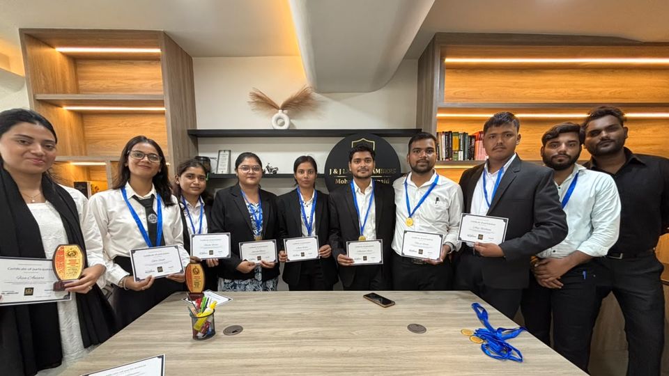 Group photo of participants with their certificates and trophies